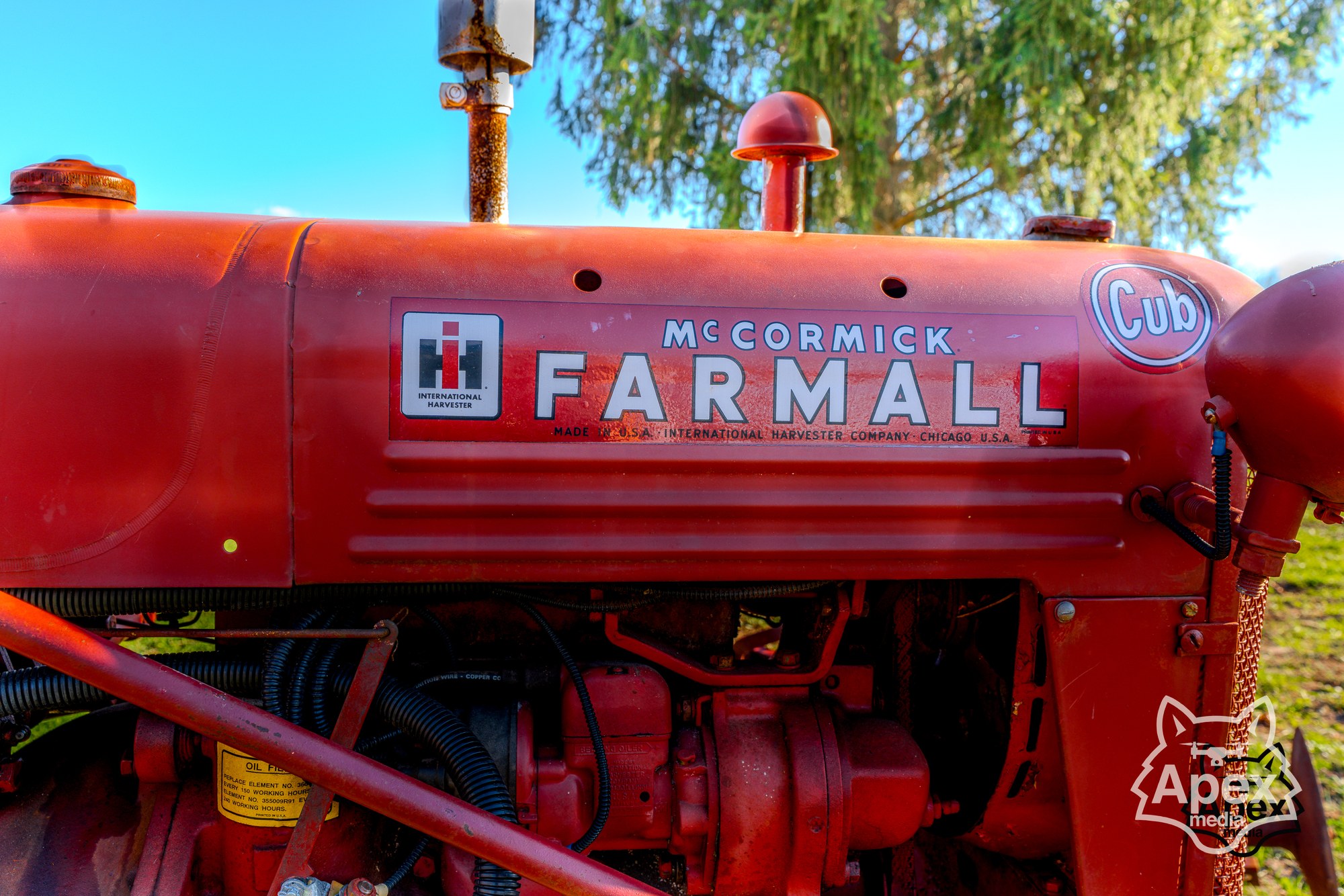 Farmall red hood close-up with engine detail