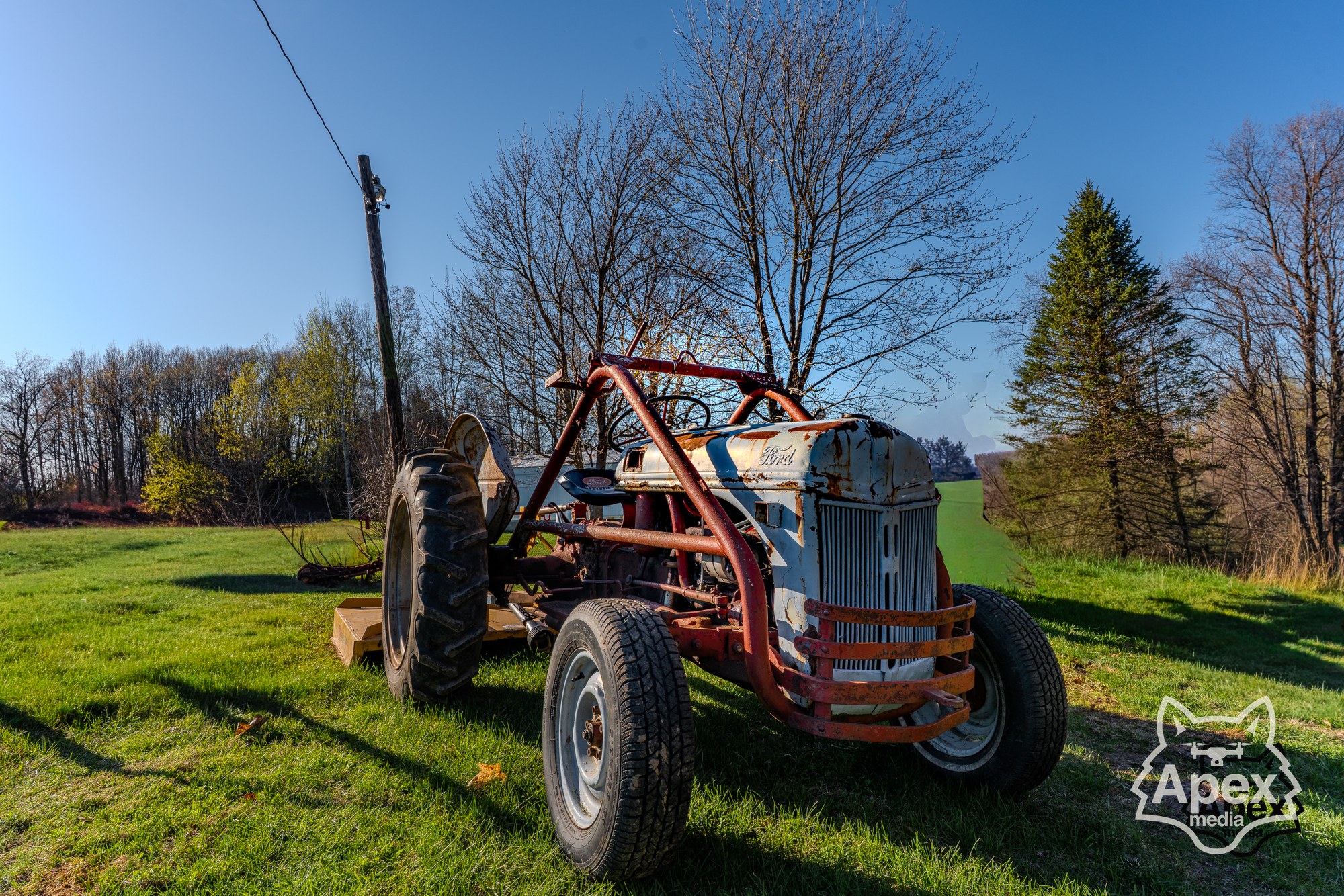 Vintage tractor lineup in open field
